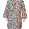 Girls white cotton suit with orange peach and green leaf print featuring orange lace trim on the neck and sleeves.