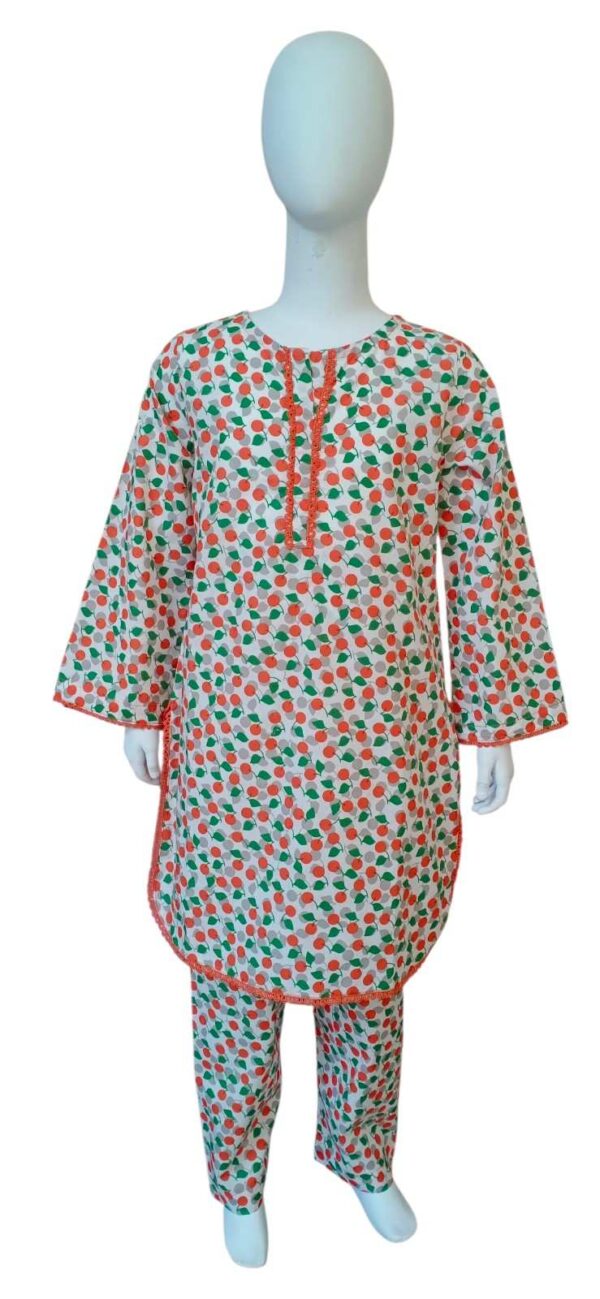 Girls white cotton suit with orange peach and green leaf print featuring orange lace trim on the neck and sleeves.